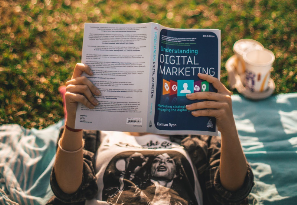 A person reading a digital marketing book